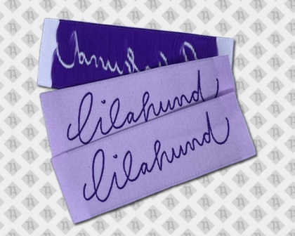 Label gewebt mit Laserschnitt in Lila – Motiv "lilahund", modernes Design